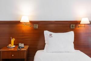 Postel nebo postele na pokoji v ubytování Hotel Comendador