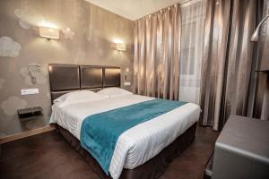 Postelja oz. postelje v sobi nastanitve Hôtel d'Orléans