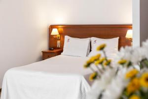 Postel nebo postele na pokoji v ubytování Hotel Comendador