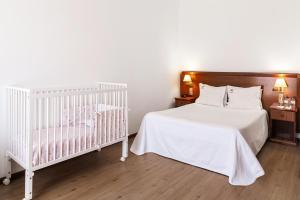 Postel nebo postele na pokoji v ubytování Hotel Comendador