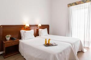 Postel nebo postele na pokoji v ubytování Hotel Comendador