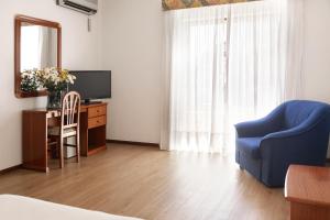 TV a/nebo společenská místnost v ubytování Hotel Comendador
