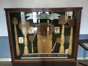 a display of different types of brushes in a wooden case at Wheatland Hotel in Strathmore