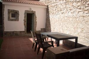 a table and chairs sitting on a patio at El Descansito del Rey in El Chorro