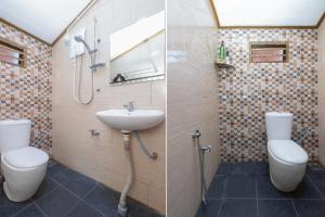 een badkamer met een wastafel, een toilet en een douche bij OYO 89873 Nurbayu Chalet in Kuantan