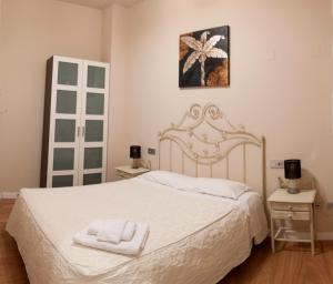 Cama o camas de una habitación en SEVITUR Seville Comfort Apartments
