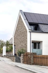 a house with solar panels on the roof at Mandula Villa in Tihany