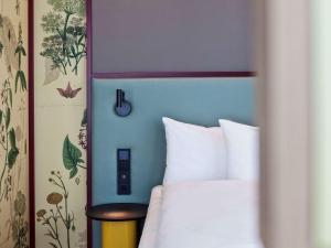 ibis Styles Klagenfurt am Woerthersee客房内的一张或多张床位
