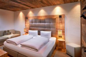 Postel nebo postele na pokoji v ubytování Promi Alm Flachau - Luxus Chalets