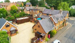 an aerial view of a house with a yard at The Old Post House in Naseby