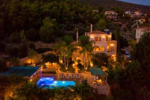 an aerial view of a house at night at Villa Maira Luxurious with private swimming pool in Korfos