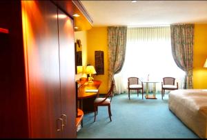 Letto o letti in una camera di Parkhotel