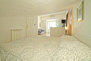 Postel nebo postele na pokoji v ubytování Apartments Udovicic HH
