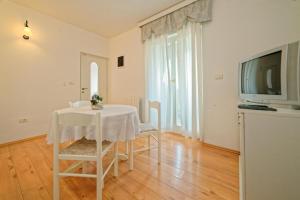 TV a/nebo společenská místnost v ubytování Apartments Udovicic HH