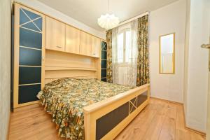 Postel nebo postele na pokoji v ubytování Apartments Udovicic HH
