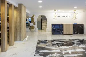 a lobby with marble flooring and a car palace sign at Jo An Palace in Rethymno Town