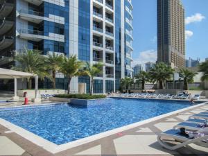 a swimming pool in the middle of a building at The Smart Concierge - Bay Central in Dubai