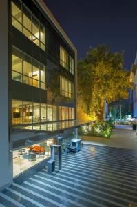 a building with a staircase in front of it at night at Park Inn by Radisson Gwalior in Gwalior