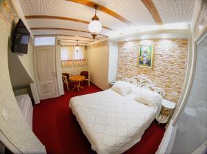 Letto o letti in una camera di Hotel Lula