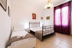 A bed or beds in a room at Fornaci Deluxe San Pietro