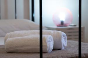 A bed or beds in a room at Fornaci Deluxe San Pietro