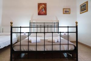 A bed or beds in a room at Fornaci Deluxe San Pietro