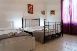 A bed or beds in a room at Fornaci Deluxe San Pietro