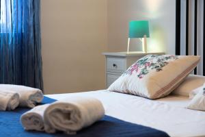 A bed or beds in a room at Fornaci Deluxe San Pietro
