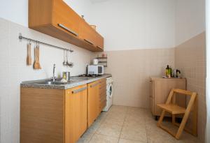 A kitchen or kitchenette at Fornaci Deluxe San Pietro