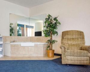 a living room filled with furniture and a large window at Comfort Inn Piketon in Piketon