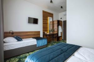 Postel nebo postele na pokoji v ubytování Bloom Hotel Airport Okęcie
