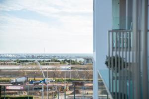 a view of an airport from a window of a building at The Convo Athens Riviera in Athens