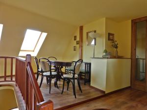 a dining room with a table and chairs at Berki Vendéglő és Hotel in Körmend