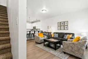a living room with a couch and a table at Gabrielle Townhomes in Boise