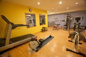 a gym with several exercise equipment in a room at Royal Son Bou Family Club in Son Bou