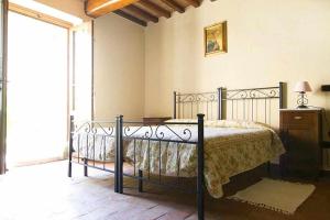 Posteľ alebo postele v izbe v ubytovaní Appartamenti con cucina nelle colline toscane