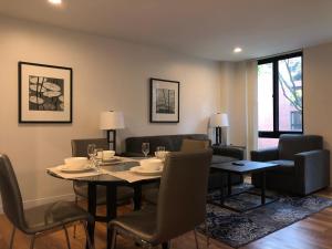 a dining room with a table and chairs at Boston Exclusive Corporate 30 Day Rental in Boston
