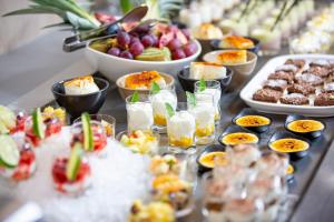 a buffet of food and drinks on a table at Kyriad Bellegarde - Gen&egrave;ve in Bellegarde-sur-Valserine