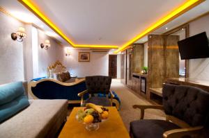 A television and/or entertainment centre at Grand Ambiance Hotel