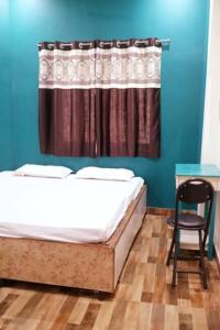 Postel nebo postele na pokoji v ubytování RELAX PAYING GUEST HOUSE
