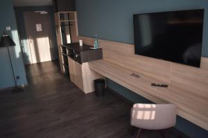 TV a/nebo společenská místnost v ubytování Hotel Viktorosa