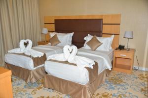 Postel nebo postele na pokoji v ubytování Ozone hotel