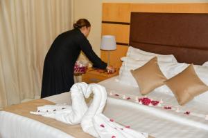 Postel nebo postele na pokoji v ubytování Ozone hotel