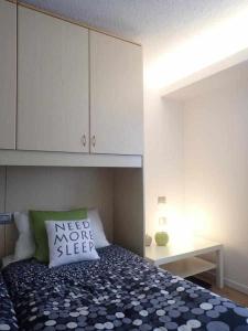 A bed or beds in a room at Bilocale con cucina a 300 m dalle piste