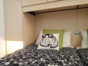 A bed or beds in a room at Bilocale con cucina a 300 m dalle piste