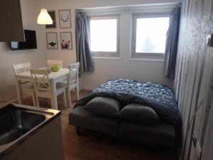 A bed or beds in a room at Bilocale con cucina a 300 m dalle piste