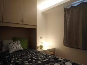 A bed or beds in a room at Bilocale con cucina a 300 m dalle piste