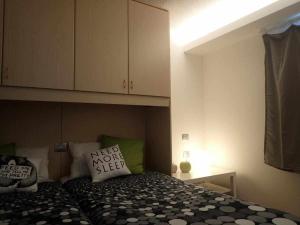 A bed or beds in a room at Bilocale con cucina a 300 m dalle piste