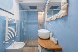 a bathroom with a sink and a toilet and a shower at Villa Costanza Amalfi Coast in Maiori +42 photos