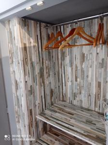 a room with wooden hangers on a wall at Candelaria vistas al mar in Candelaria +23 photos